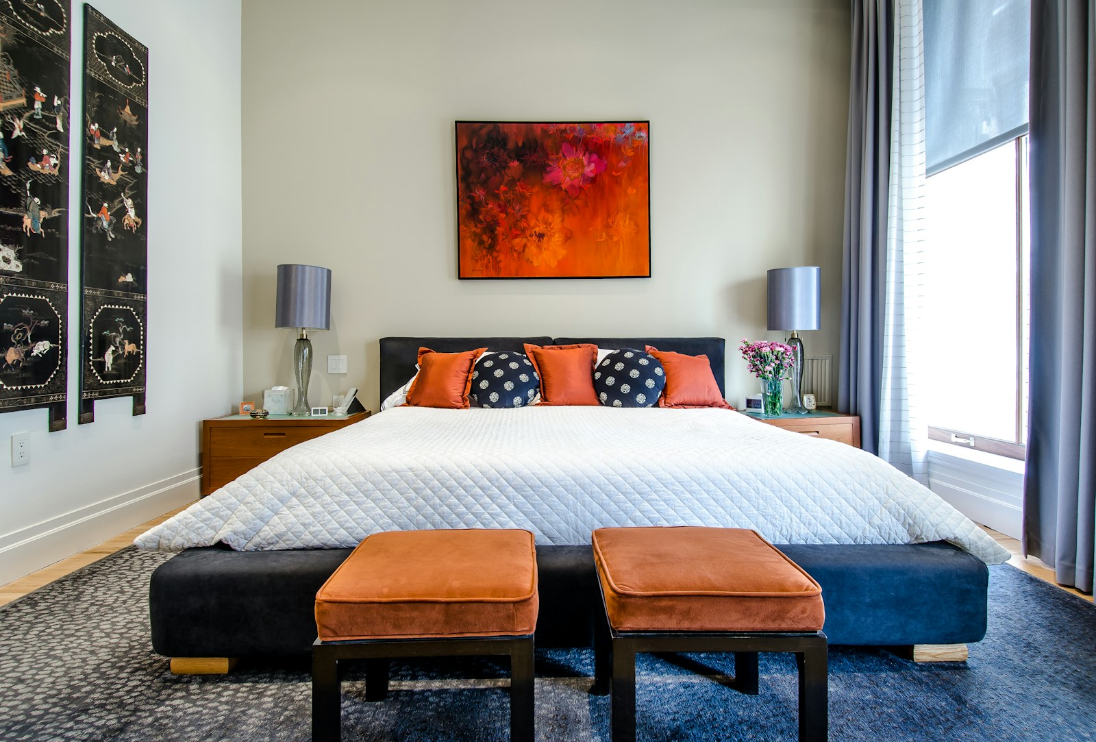 A peaceful bedroom with a neatly made bed in soft morning light