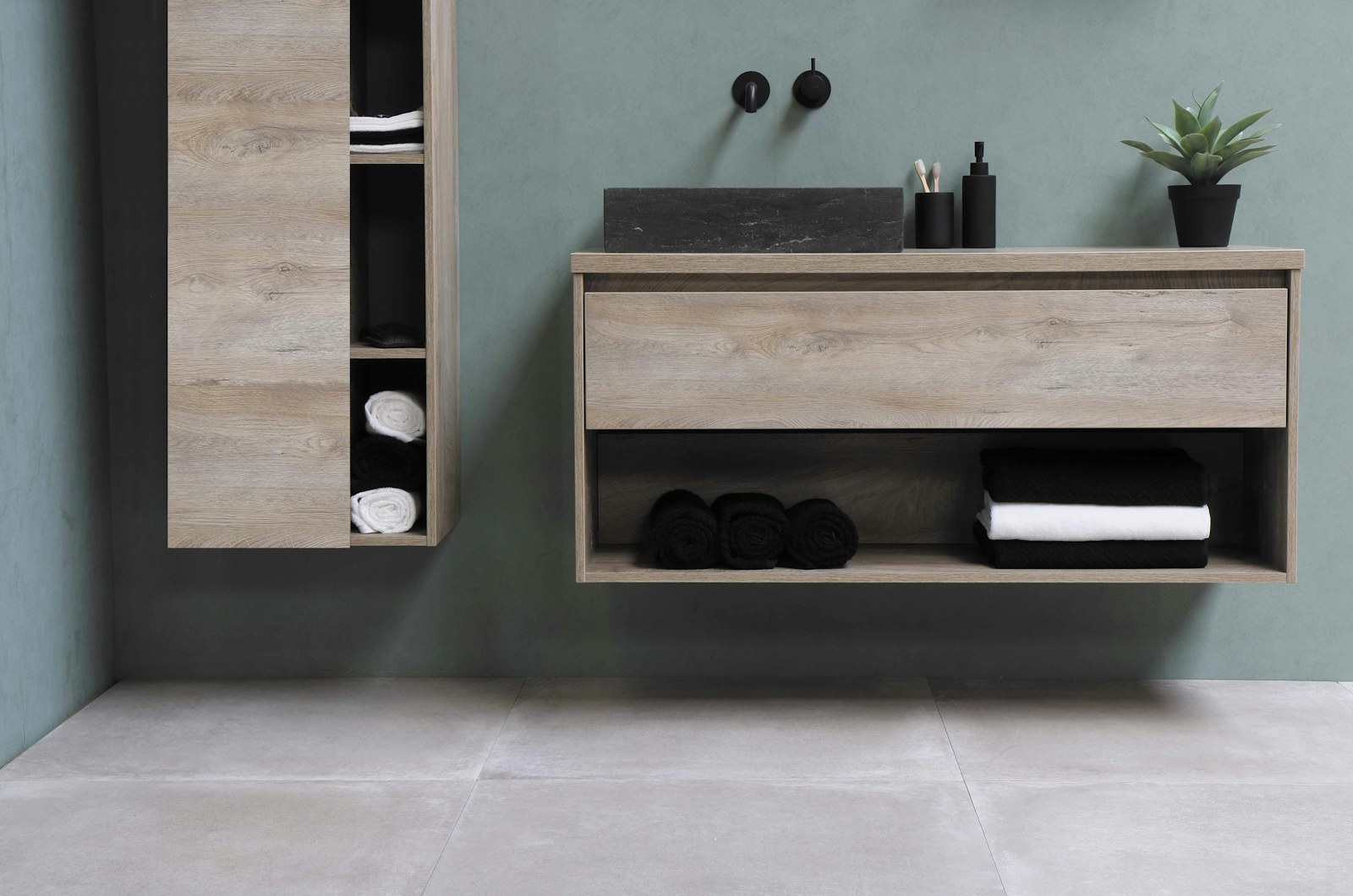 A compact apartment workspace with an adjustable standing desk